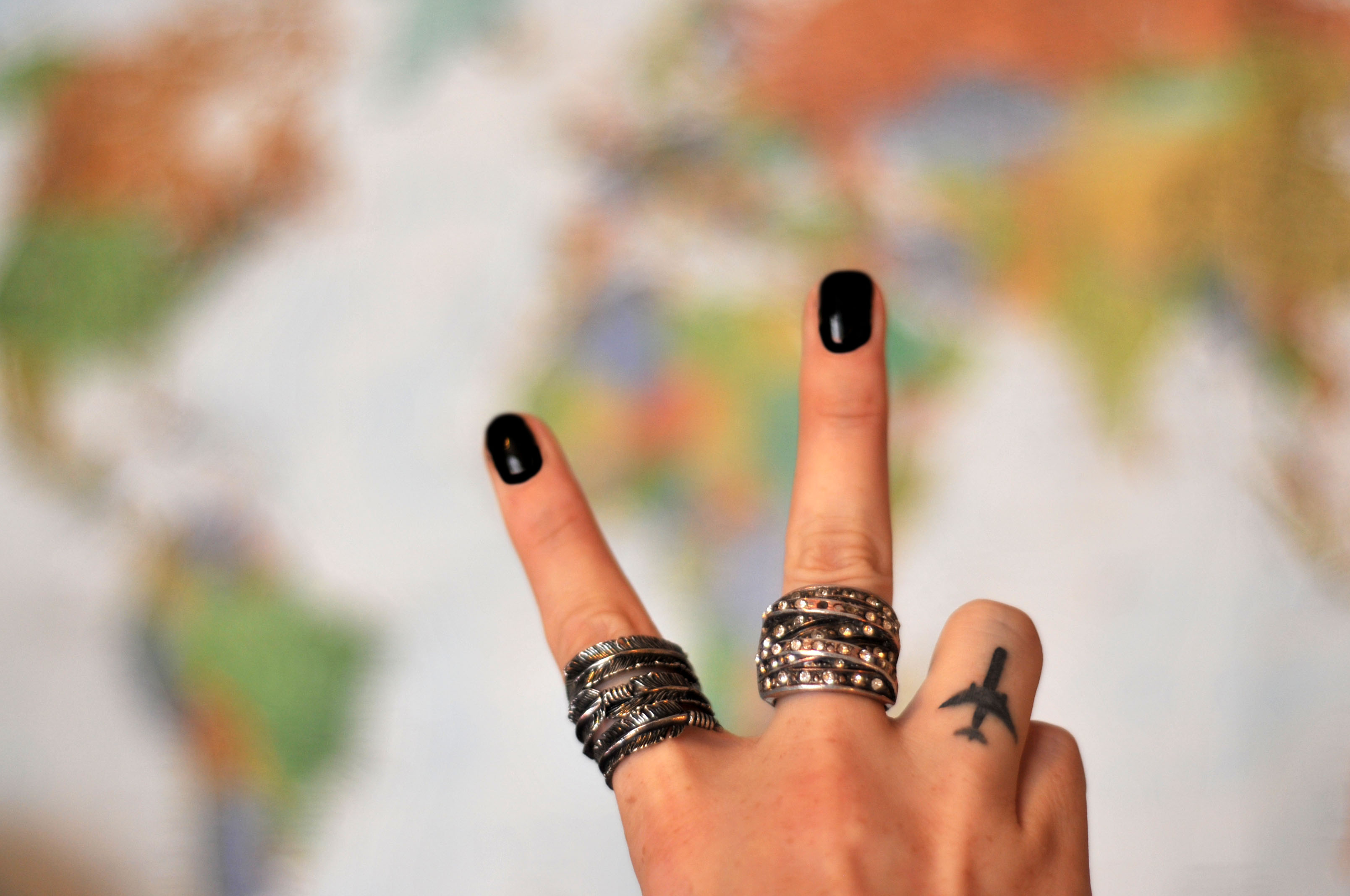 An airplane finger tattoo