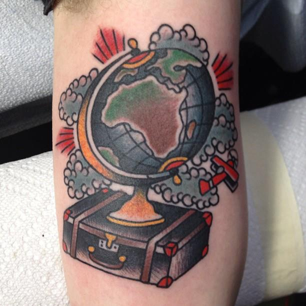 Globe and suitcase tattoo