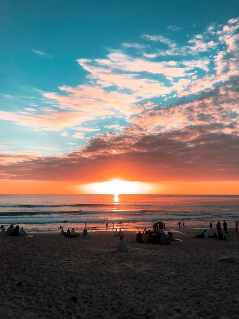 Relax by Kuta Beach and watch a scenic sunset