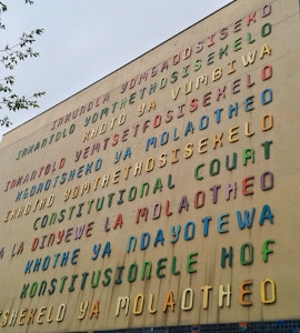 "Constitutional Court" on the front facade of the Court in all of South Africa's eleven official languages.