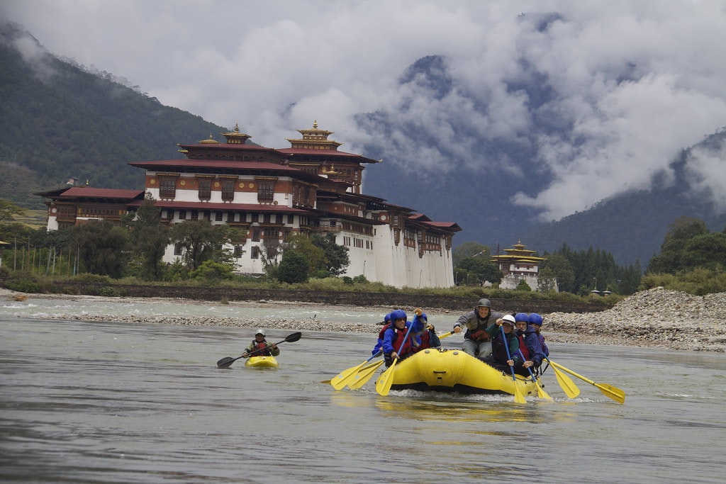 Group of people enjoying river rafting in Bhutan
