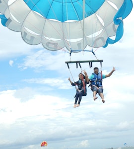 A couple flying high in the skies of Bali