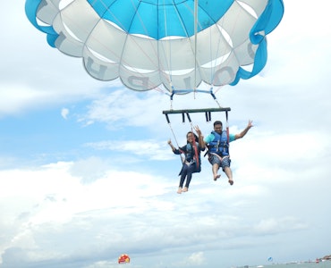 A couple flying high in the skies of Bali