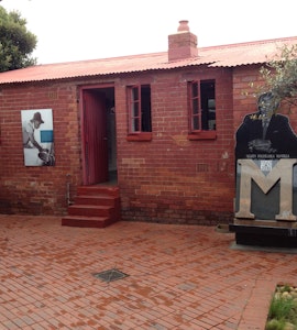 A picture of the red-bricked Mandela House in Soweto