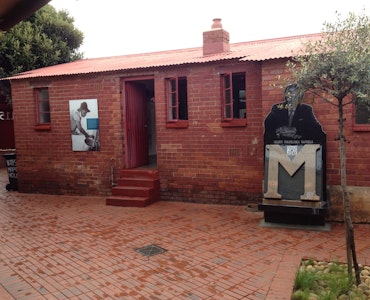 A picture of the red-bricked Mandela House in Soweto