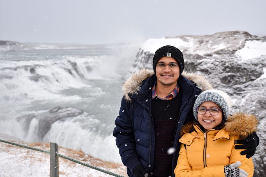 A couple posing for a picture on their honeymoon to Iceland
