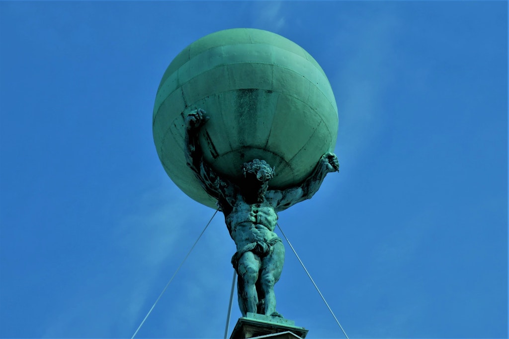 Atlas/Titan carrying heaven on his shoulders on the front facacde Royal Palace in Amsterdam