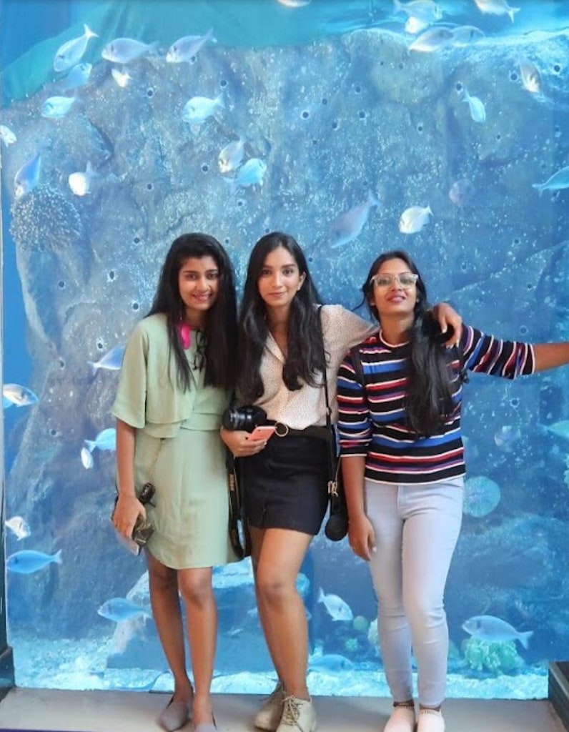 A group of friends at the Dubai aquarium