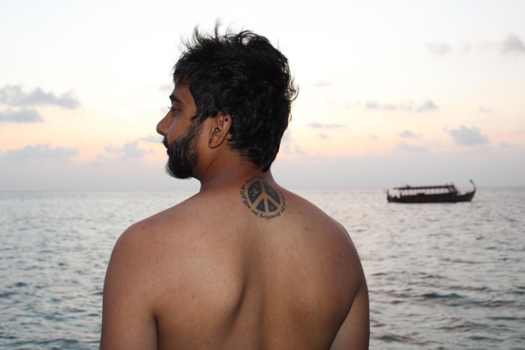 A man with a background of Sea in maldives