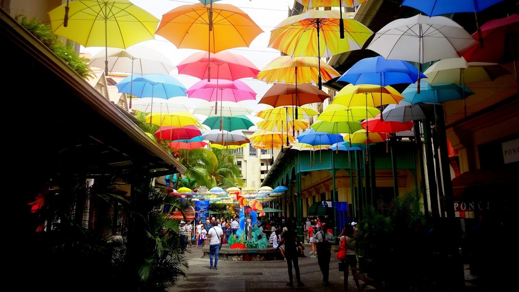 An amazing view of art umbrellas in the street in Port Louis