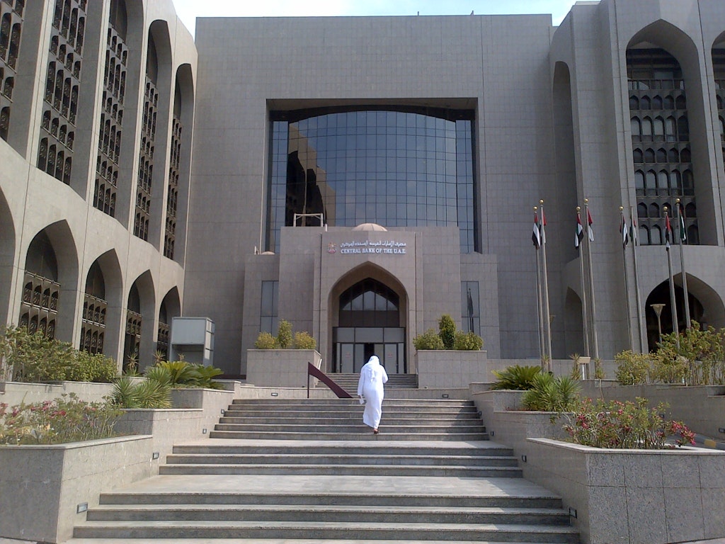 A man at the Central bank of UAE, one of the symbols of dirhams