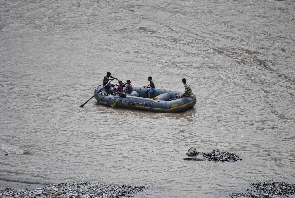 A picture of a group of people enjoying white water rafting in River Teesta