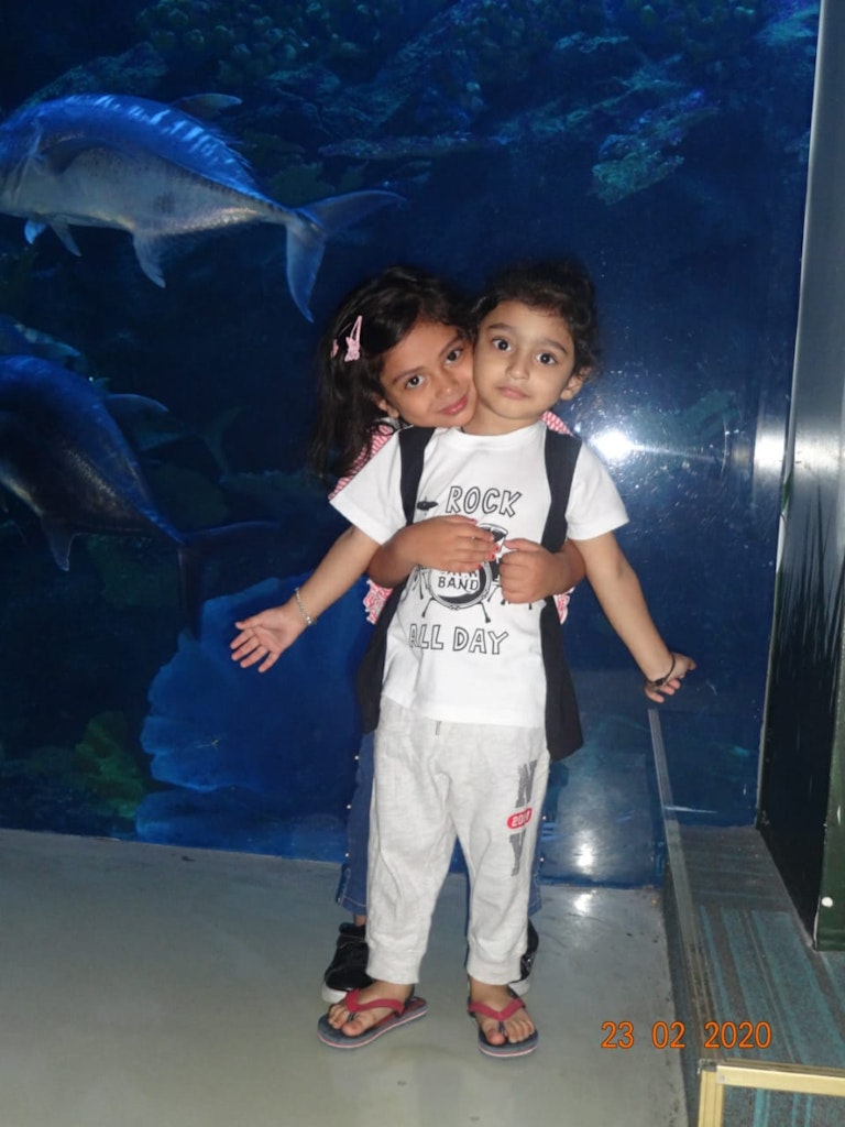A cute picture of kids posing at the Dubai Aquarium