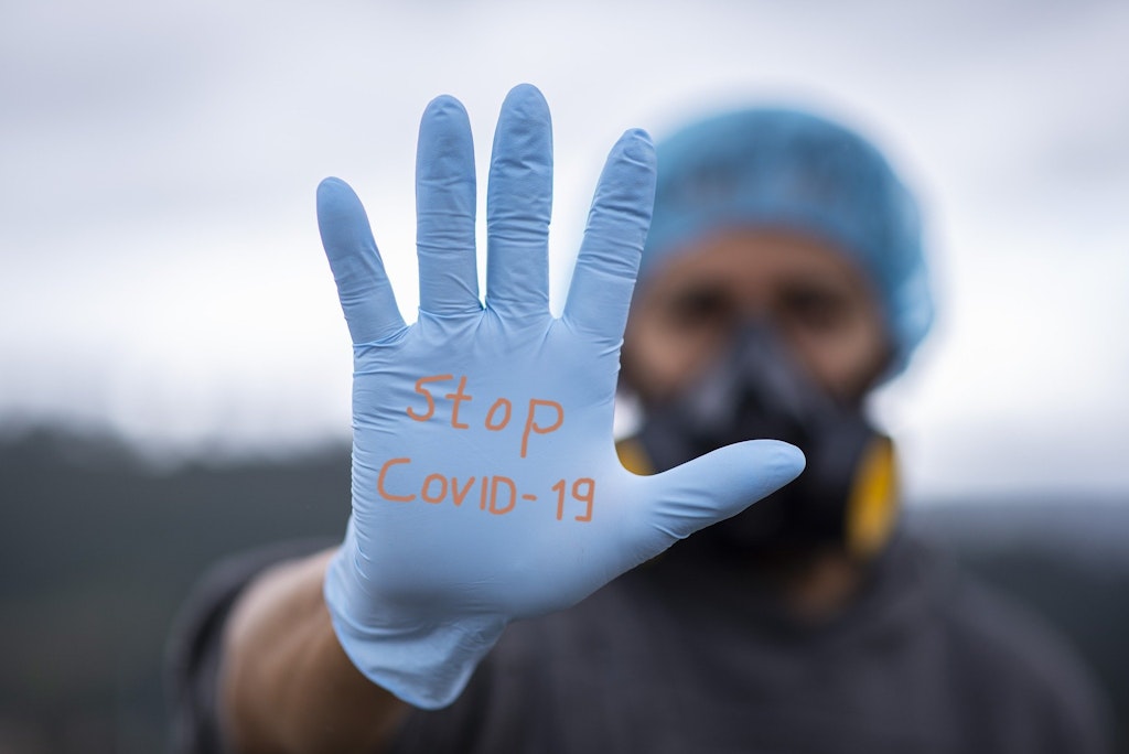A picture representing the idea of stopping COVID-19 by making the masks and gloves mandatory