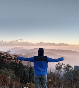 A man enjoying the natural beauty in Darjeeling