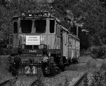 A black and white picture of a train in Varese, Italy