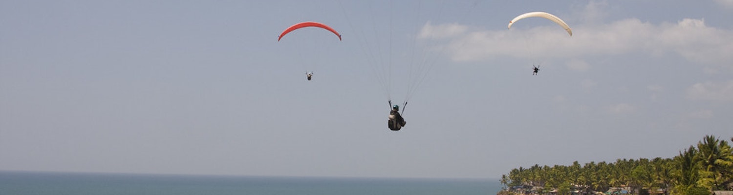 A picture of a group of people paragliding in Varkala