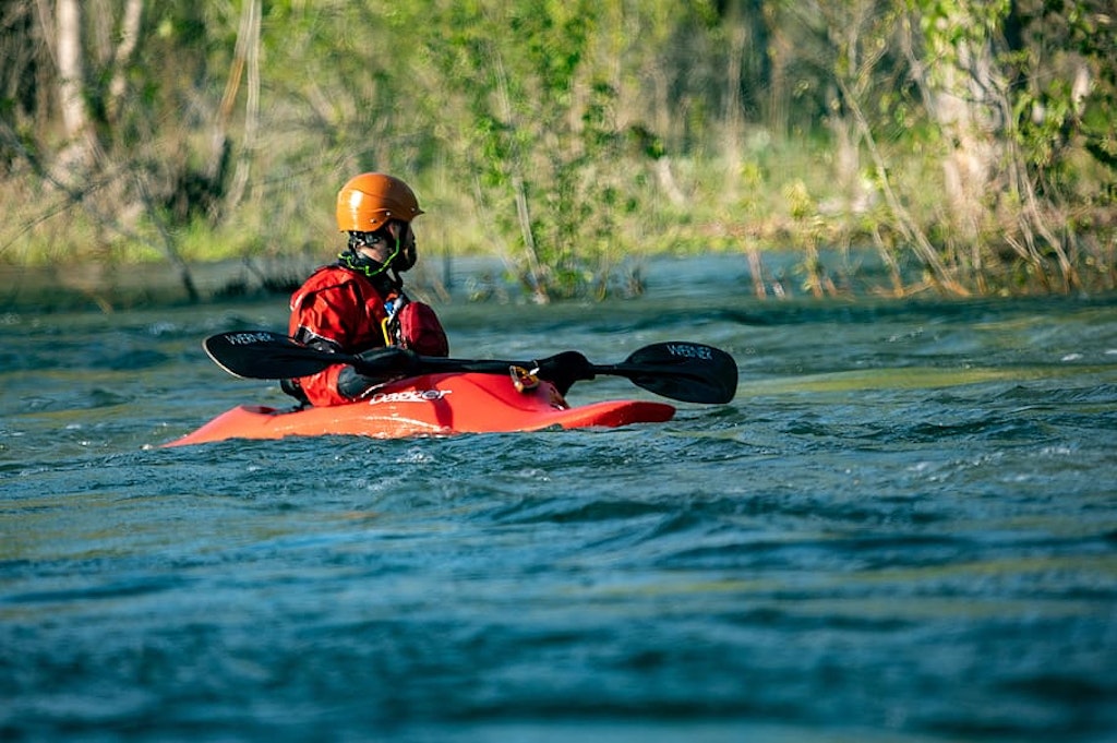 a man kayaking on a river