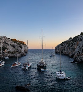 Couple of boats sailing in Menorca