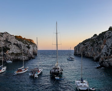 Couple of boats sailing in Menorca