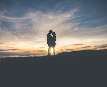 A silhouette image of a couple