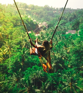 A girl on a swing in Bali