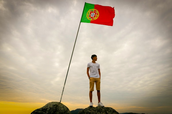 A guy and a Portugal flag